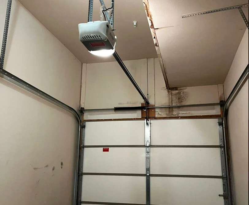 Professional installing a garage door opener at a residential home in Laurel, Florida – Garage Door Opener Installation Services