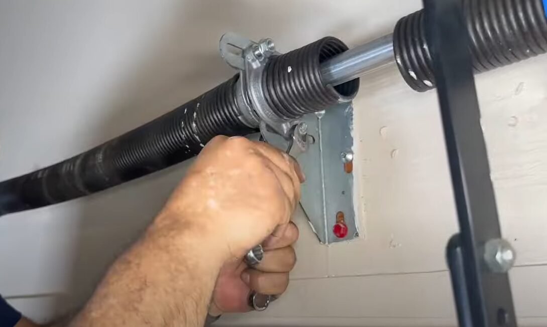 a technician performing garage door spring repair in Laurel, Florida, ensuring smooth and safe garage door operation.