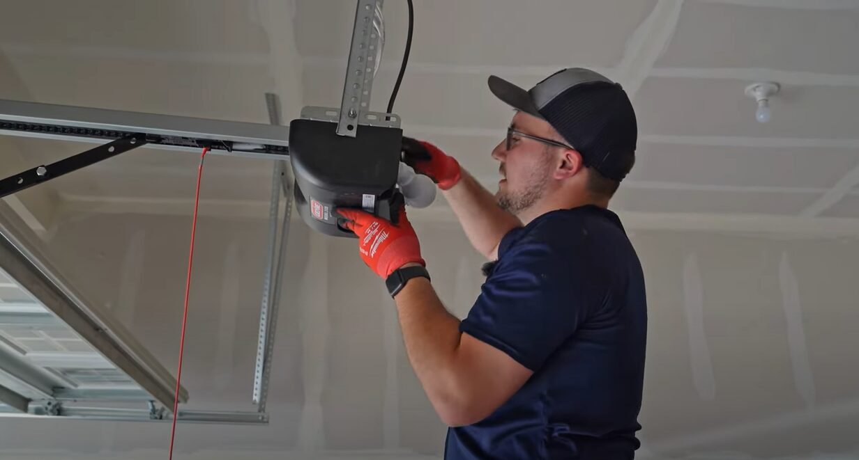 a technician repairing a garage door spring at a residential property in Laurel, Florida, showcasing professional repair service by Garage Door Services.